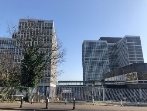 A group of tall buildingsDescription automatically generated with low confidence