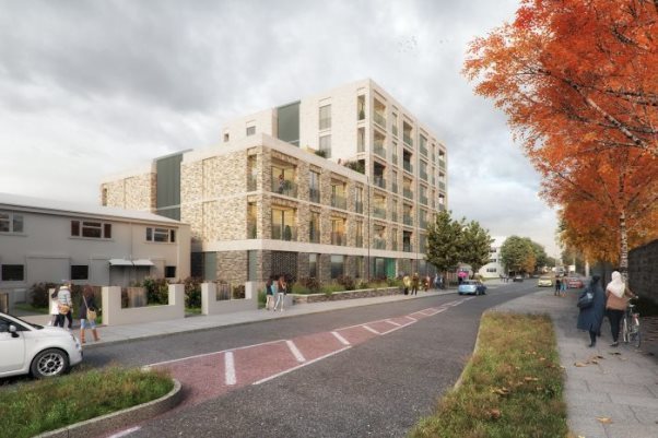 A building with trees and a streetDescription automatically generated