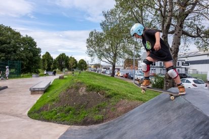 A person riding a skateboardDescription automatically generated