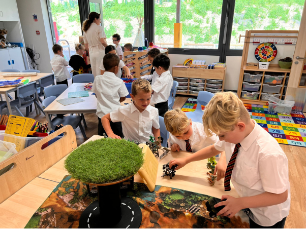 A group of children in a classroomDescription automatically generated