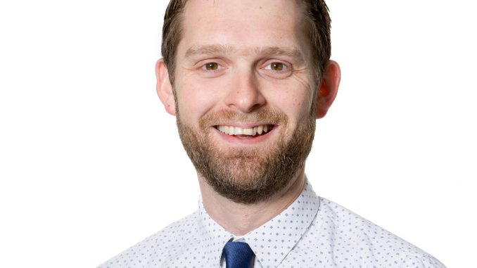 Man in front of a white background