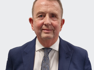 Man standing in front of a grey background