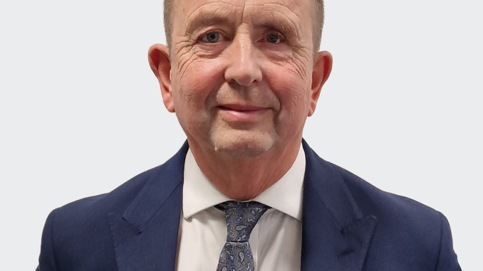 Man standing in front of a grey background
