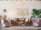 brown leather sofa and two pink sofa chair