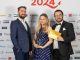 Genesis Biosciences posing with their award at the 2024 Wales Business Awards.