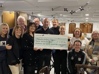 Popham Kidney Support CEO, Joanne Popham (center-left) & Administrator, Ava Houston-Phillips (center-right), with Cwmtwrch Rugby Club committee members.