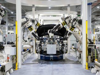 An electric vehicle in production at a factory.