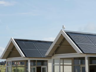Two roof tops with solar panels.