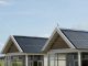 Two roof tops with solar panels.