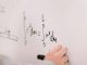 person writing on white paper