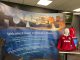 The Howden Wales banner next to a signed Lions shirt at the Lions fundraising event.