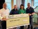 Popham CEO Joanne Popham and Trustee Kim Loosmore with The Construction Club’s Jamie Lannen and Geraint Hopkins, who contributed £3,000 to the £14,000 raised.