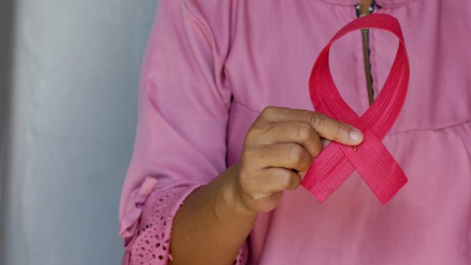 woman in pink and white polka dot shirt