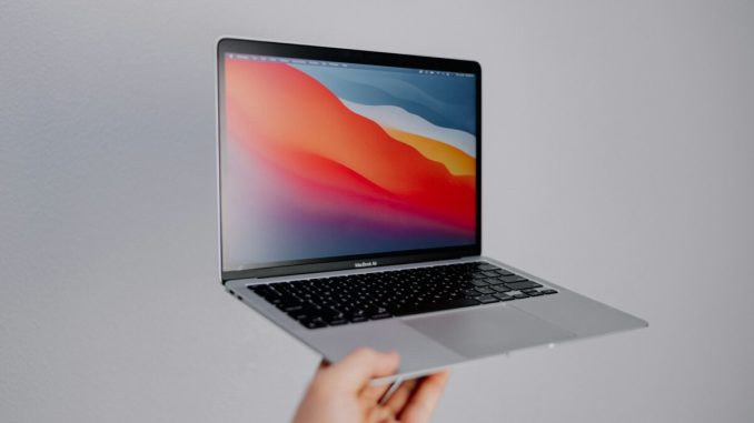 macbook pro on white table