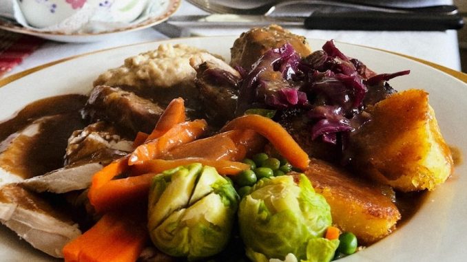 A plate of food on a table in a kitchen