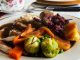 A plate of food on a table in a kitchen