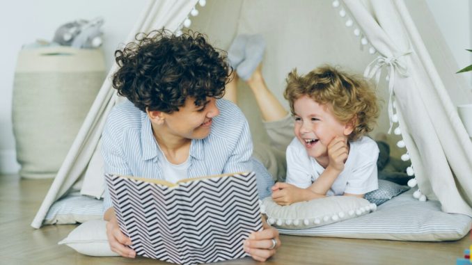 a woman reading a book to a child