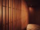 a room with wooden walls and a bench