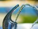 silver faucet with water droplets